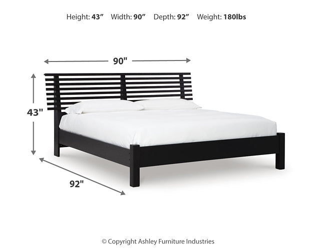 Danziar King Panel Bed with Mirrored Dresser